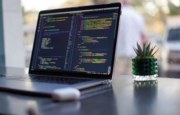laptop screen with code showing